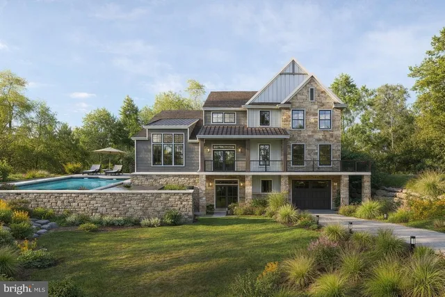 a view of a big house with a big yard and potted plants