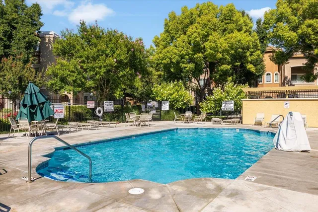 a view of a swimming pool with lounge chair