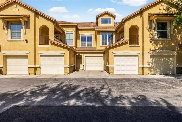 a kitchen with a sink stove and refrigerator