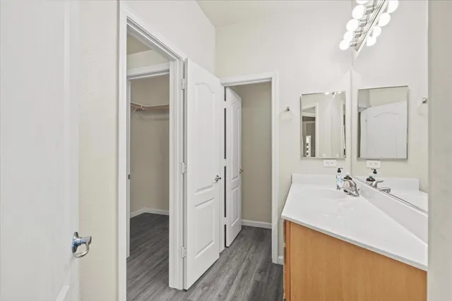a bathroom with a sink double vanity and a mirror