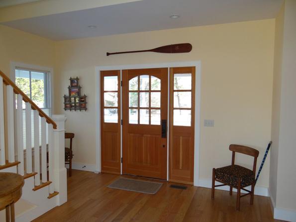64 Gibson Road Orleans, MA 02653 - Photo 14 of 27 a view of a hallway with wooden floor and windows