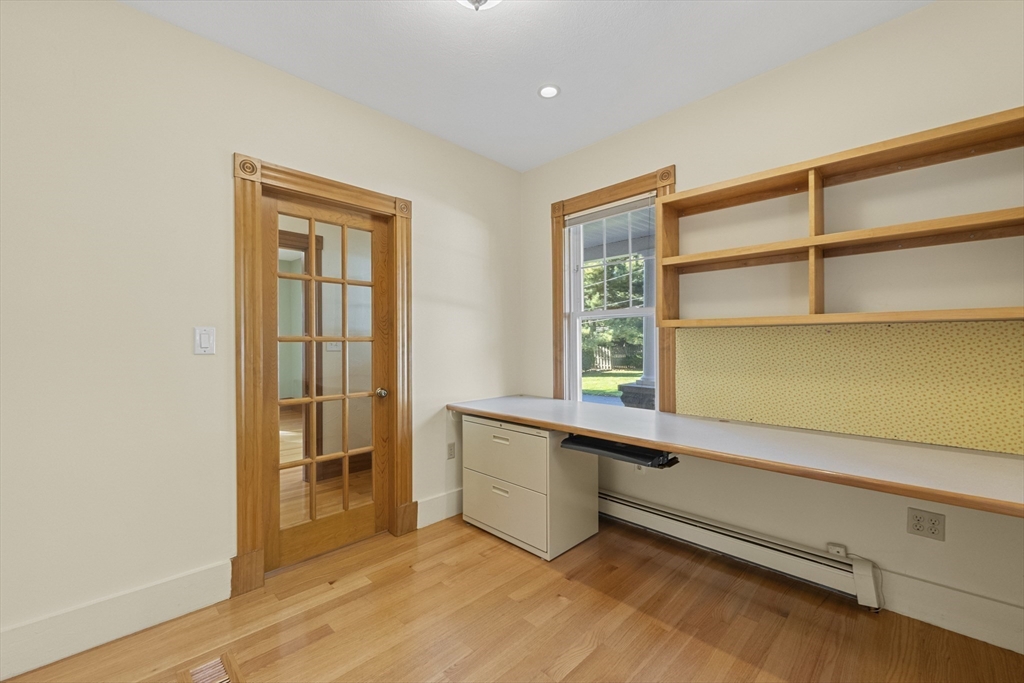 3 Laurel Street Woburn, MA 01801 - Photo 11 of 40 a room with a wooden floor and furniture