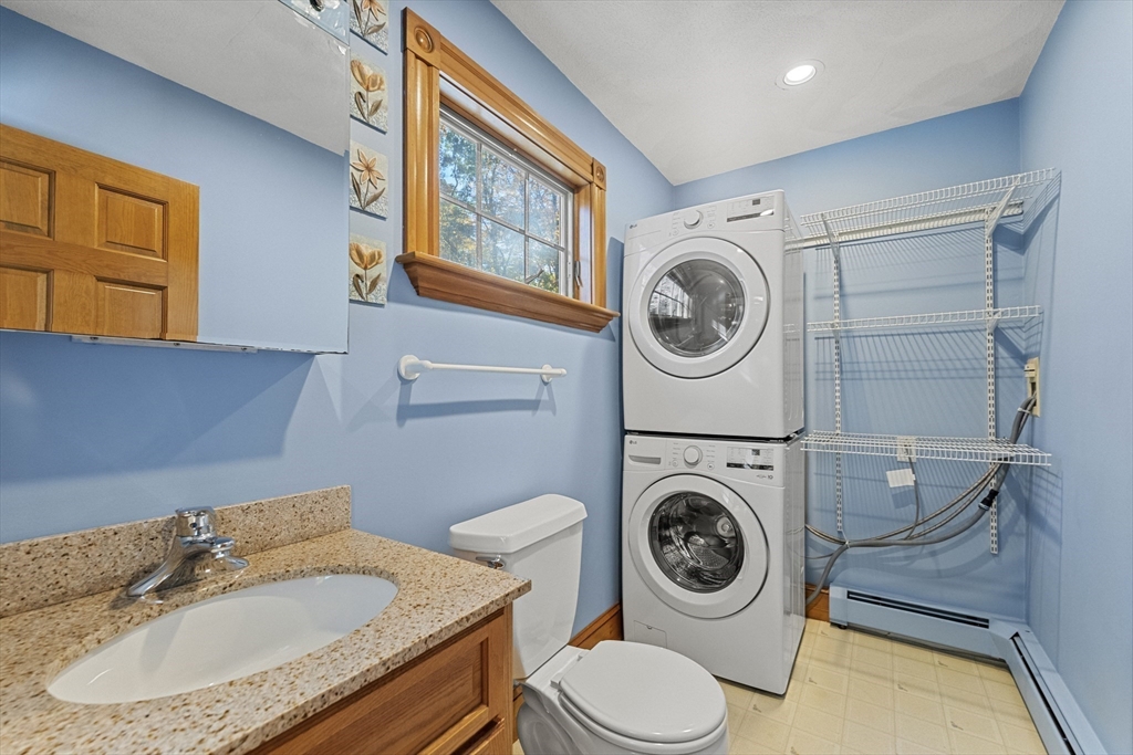 3 Laurel Street Woburn, MA 01801 - Photo 20 of 40 a bathroom with a sink a toilet and a washer