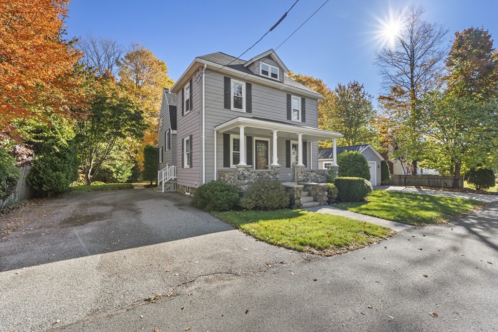 3 Laurel Street Woburn, MA 01801 - Photo 2 of 40 a front view of a house with a yard