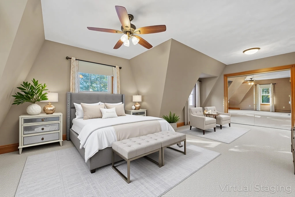 3 Laurel Street Woburn, MA 01801 - Photo 22 of 40 a spacious bedroom with a bed and a chandelier