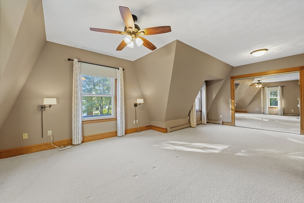 3 Laurel Street Woburn, MA 01801 - Photo 23 of 40 a view of a livingroom with a ceiling fan and window
