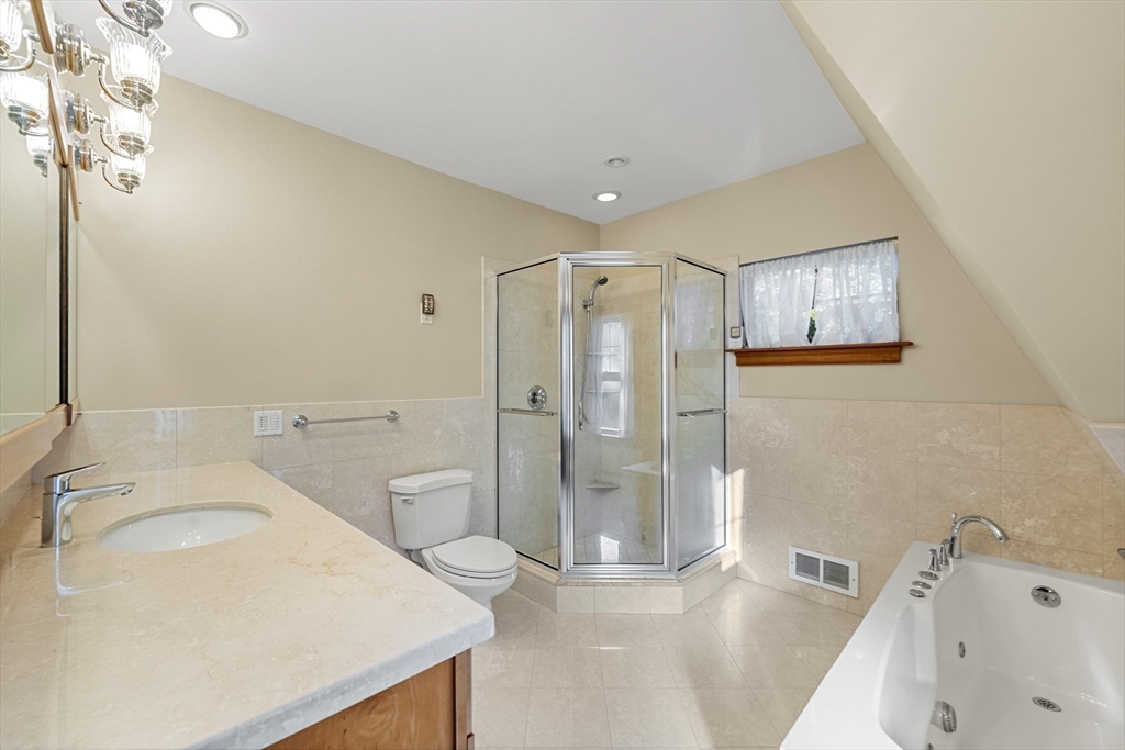 3 Laurel Street Woburn, MA 01801 - Photo 25 of 40 a bathroom with a sink a toilet and shower