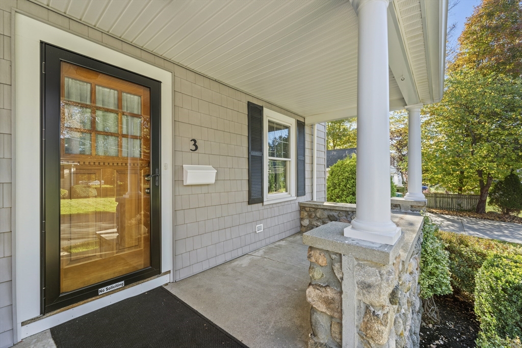 3 Laurel Street Woburn, MA 01801 - Photo 3 of 40 a front view of a house with a porch