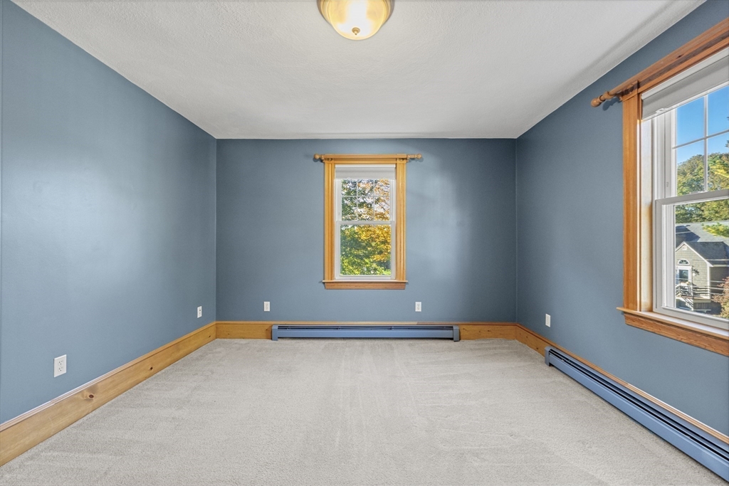 3 Laurel Street Woburn, MA 01801 - Photo 31 of 40 a view of an empty room with a window