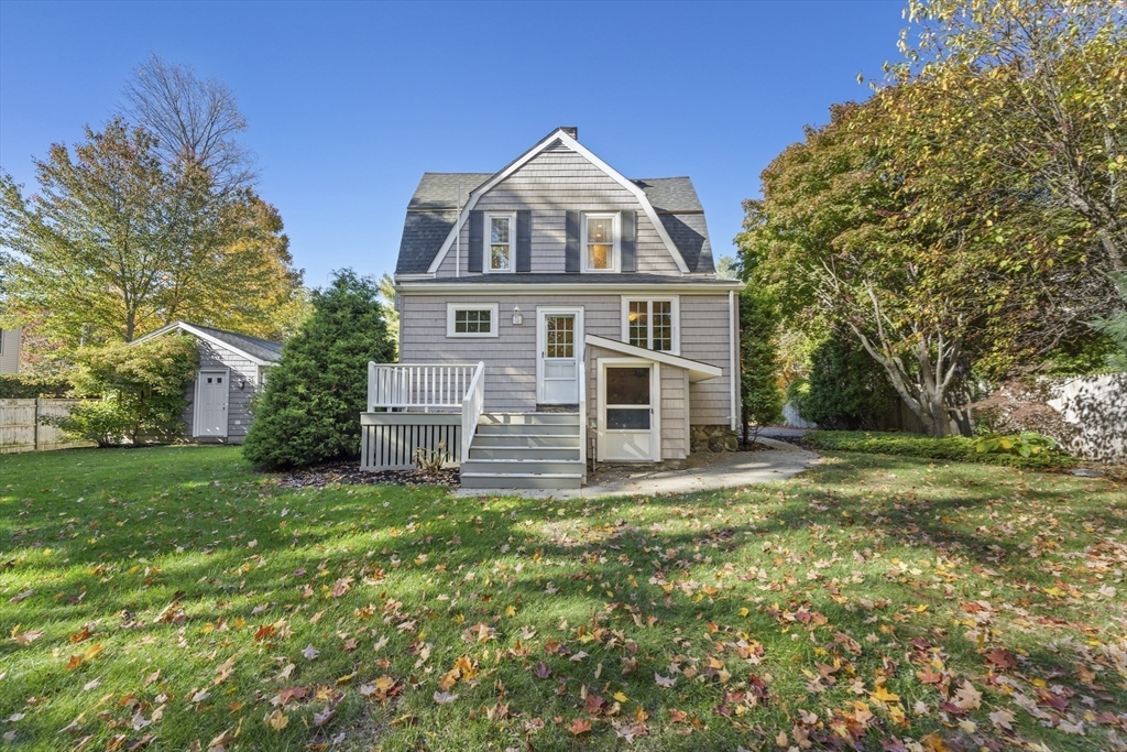 3 Laurel Street Woburn, MA 01801 - Photo 34 of 40 a view of a house with a big yard and large trees
