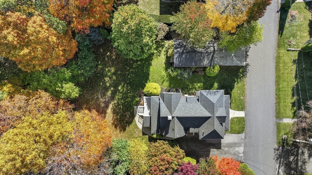 3 Laurel Street Woburn, MA 01801 - Photo 38 of 40 an aerial view of a house with table and chairs and a large tree