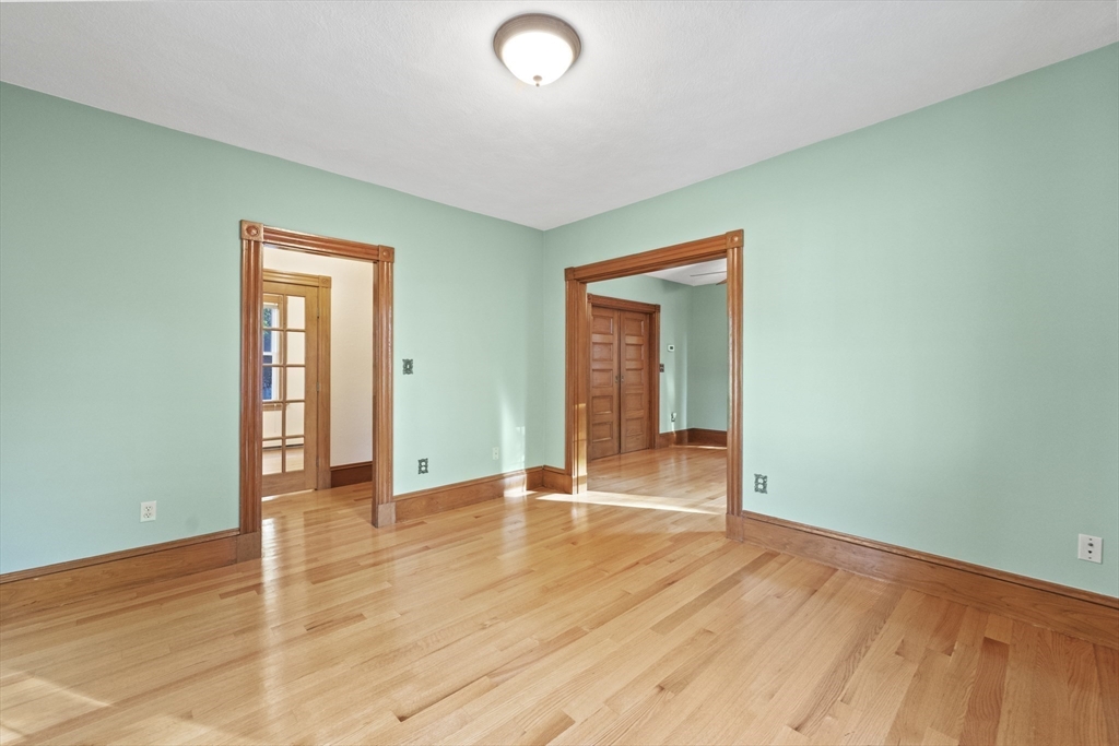 3 Laurel Street Woburn, MA 01801 - Photo 6 of 40 an empty room with wooden floor and windows
