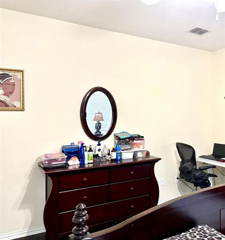 a room with a table and a potted plant