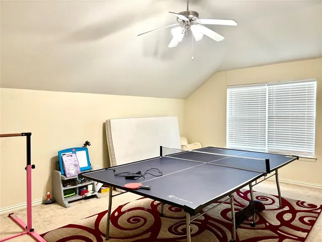 a view of a dining room with furniture and a chandelier