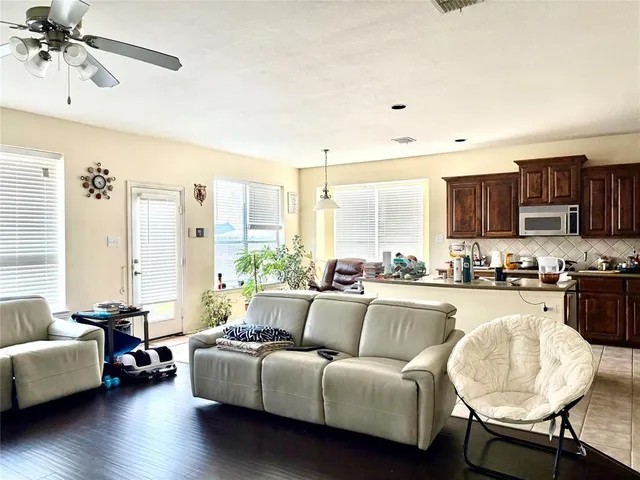 a living room with furniture and a large window