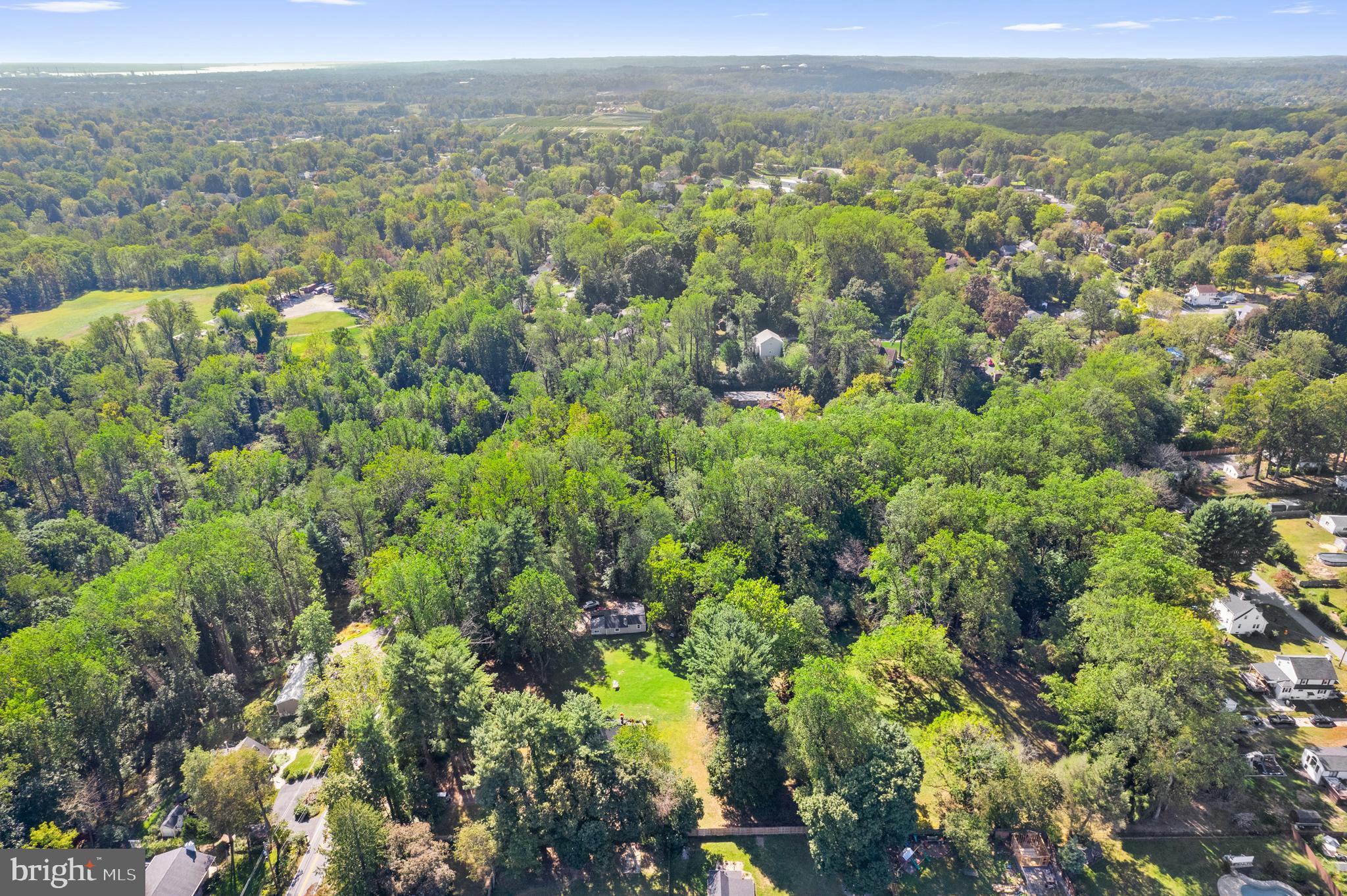219 Fox Road Media, PA 19063 - Photo 6 of 12 an aerial view of a houses with a green hillside