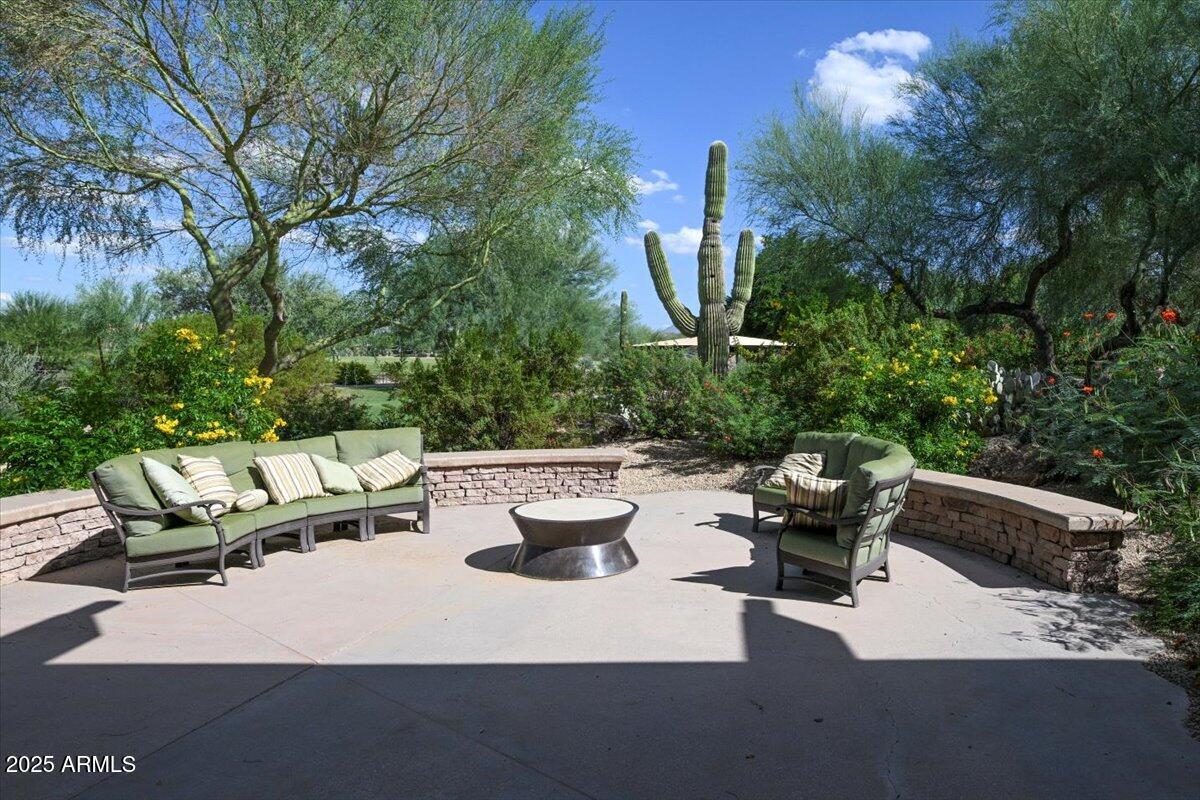 3935 East Rough Rider Road, Unit 1191 Phoenix, AZ 85050 - Photo 23 of 32 a view of patio with couches and a fire pit