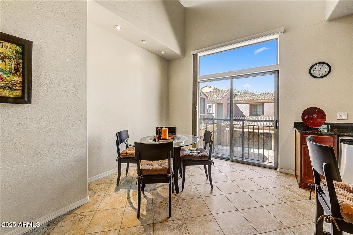 3935 East Rough Rider Road, Unit 1191 Phoenix, AZ 85050 - Photo 9 of 32 a view of a workspace with furniture