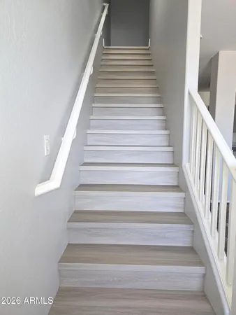 a bathroom with a sink a mirror and a toilet