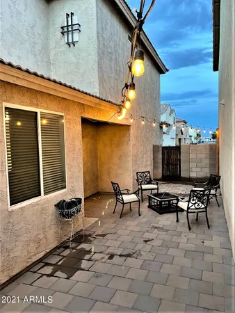 a view of a dinning table and chairs in the patio