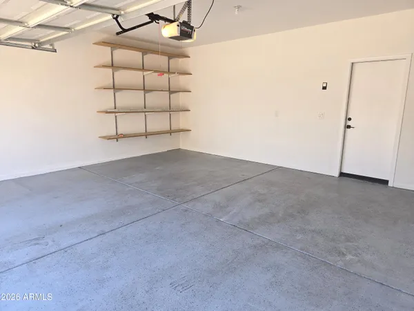 a view of a room that has a window and cabinets
