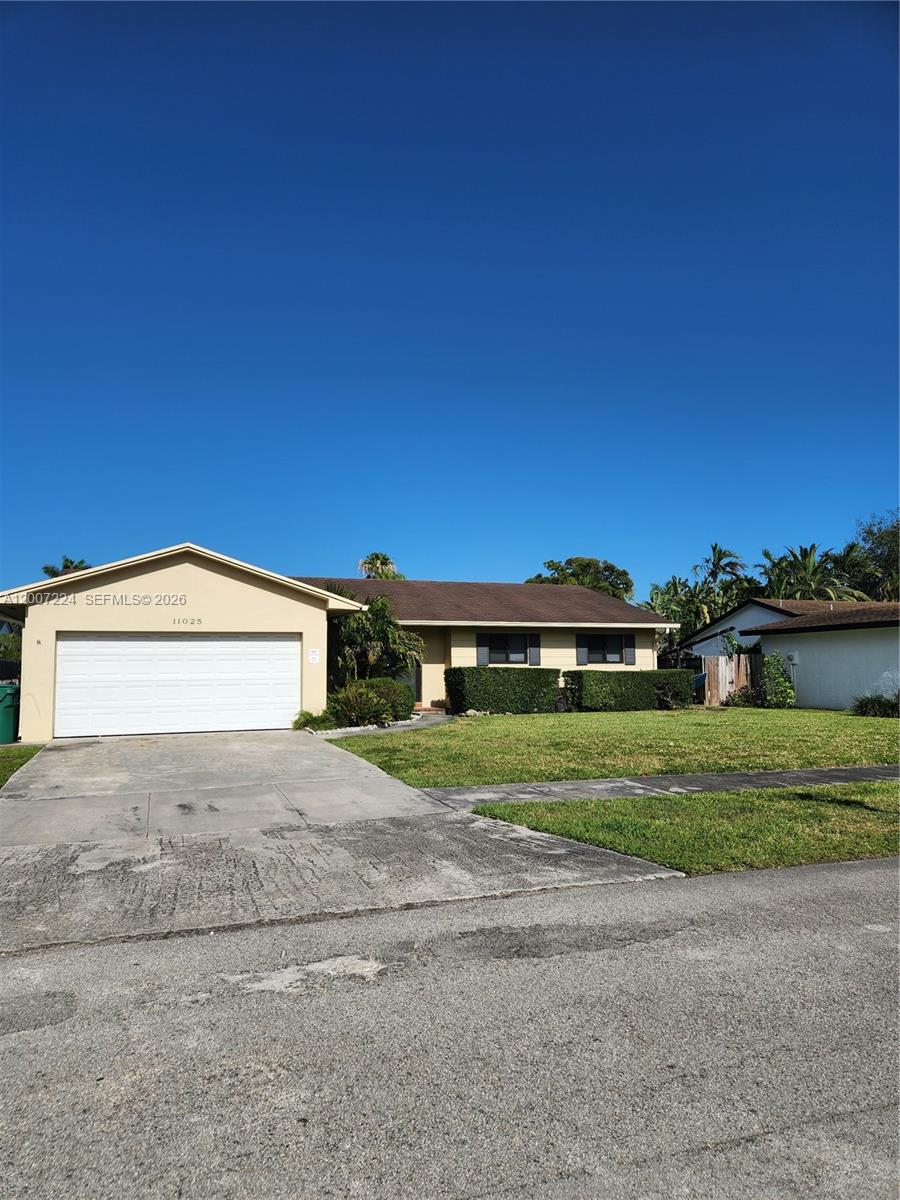 11025 Southwest 138th Court, Unit 11025 Miami, FL 33186 - Photo 1 of 21 a view of a house with a yard