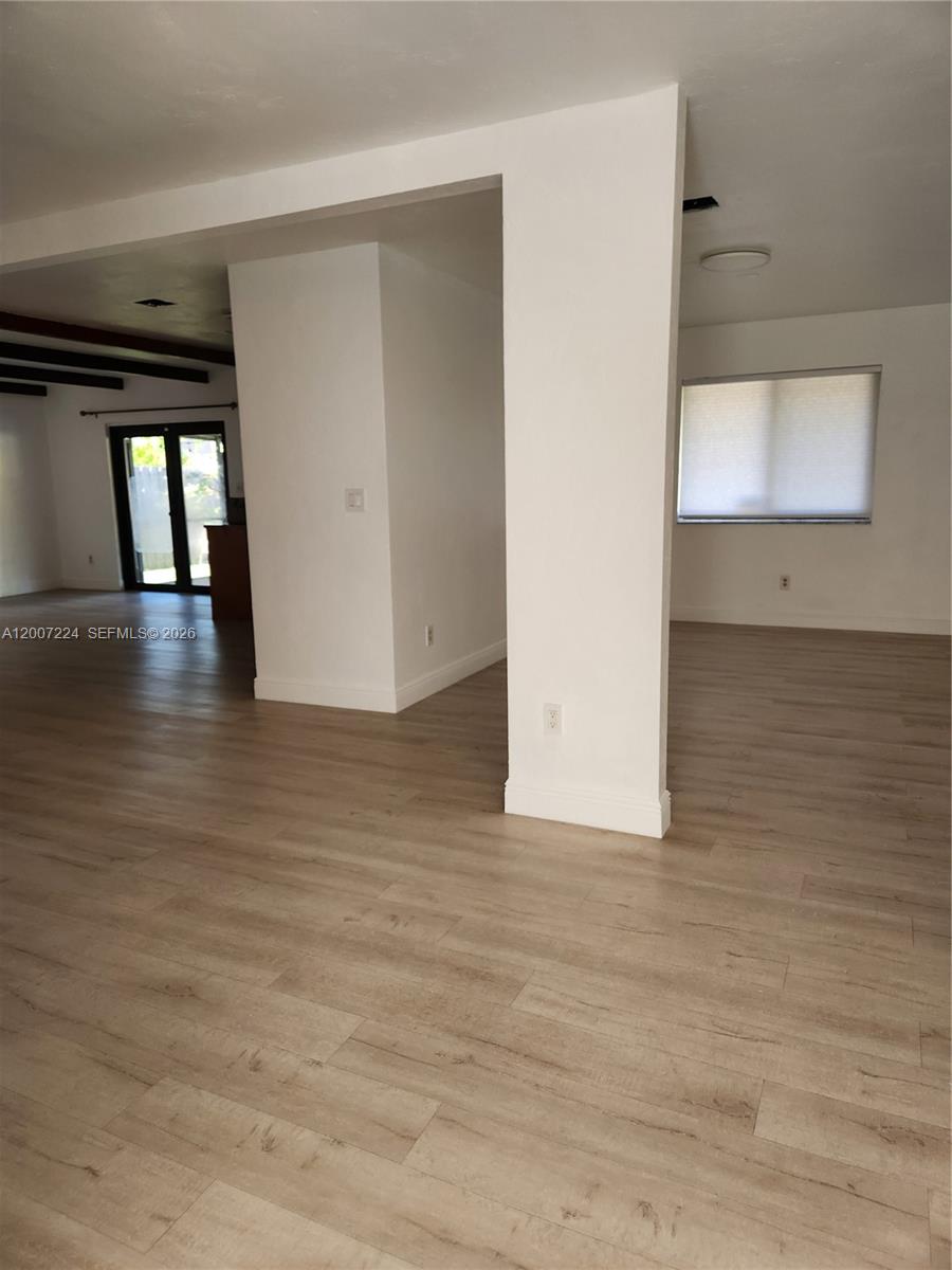 11025 Southwest 138th Court, Unit 11025 Miami, FL 33186 - Photo 7 of 21 a view of a livingroom with wooden floor