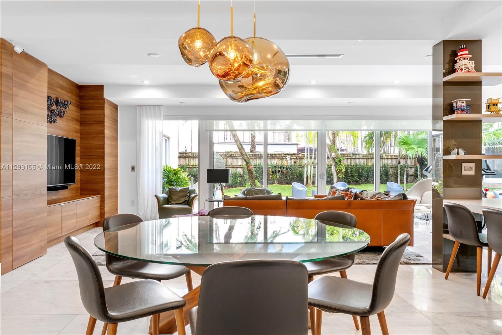 1666 Tigertail Avenue Miami, FL 33133 - Photo 14 of 41 a dining room with furniture a rug and a large window