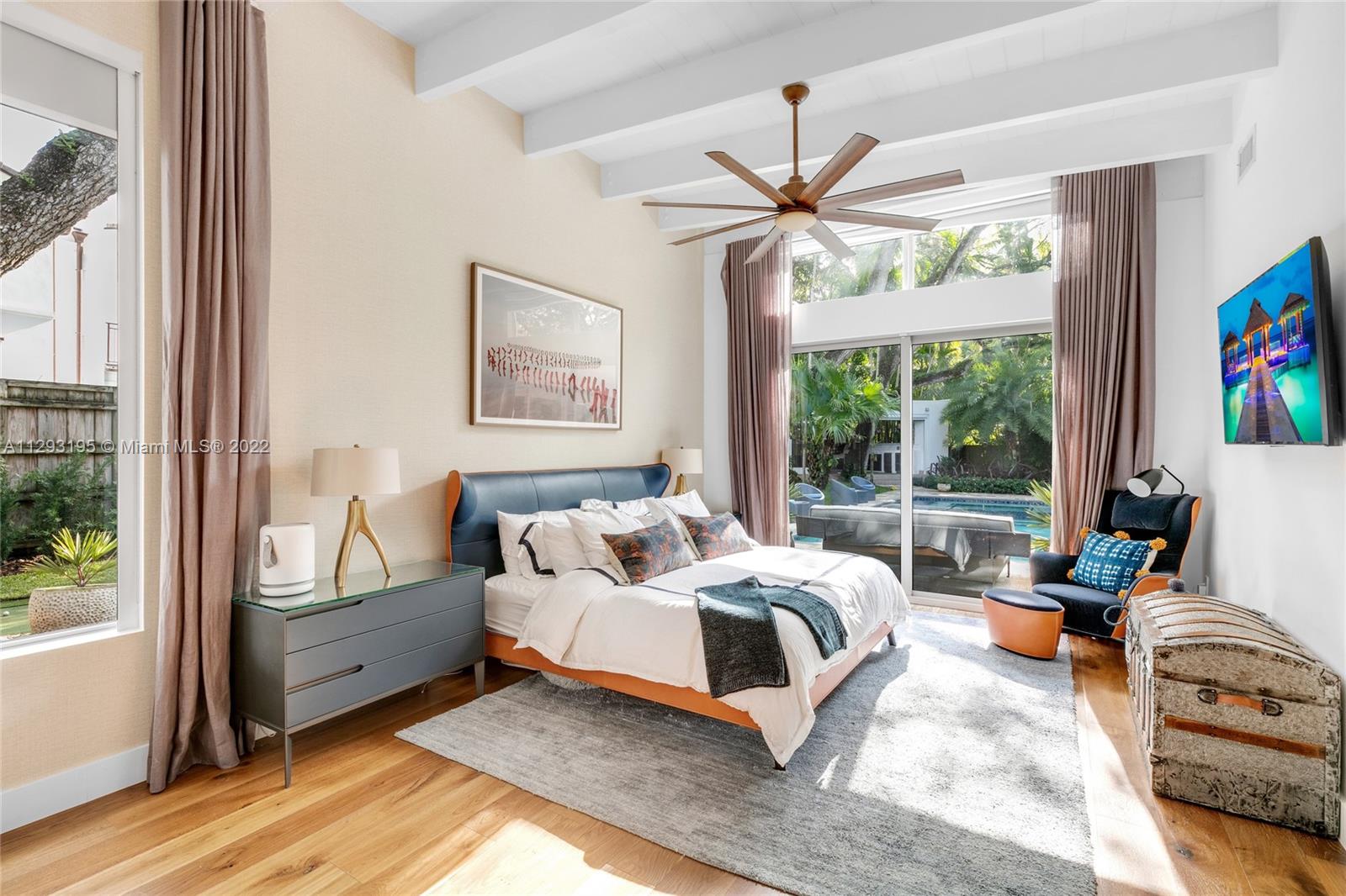 1666 Tigertail Avenue Miami, FL 33133 - Photo 15 of 41 a bedroom with bed and a large window with outer view