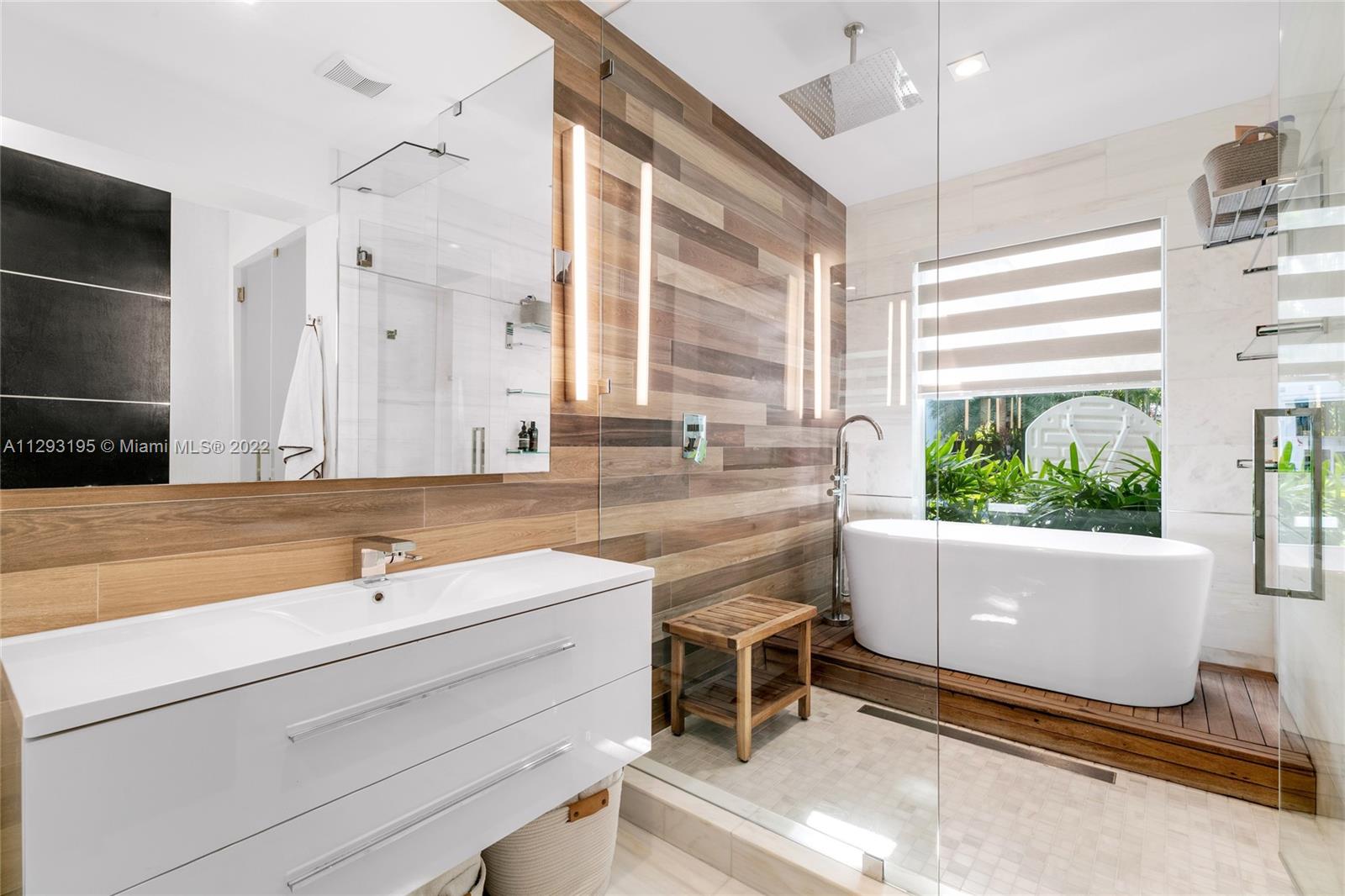 1666 Tigertail Avenue Miami, FL 33133 - Photo 18 of 41 a bathroom with a sink and a large window