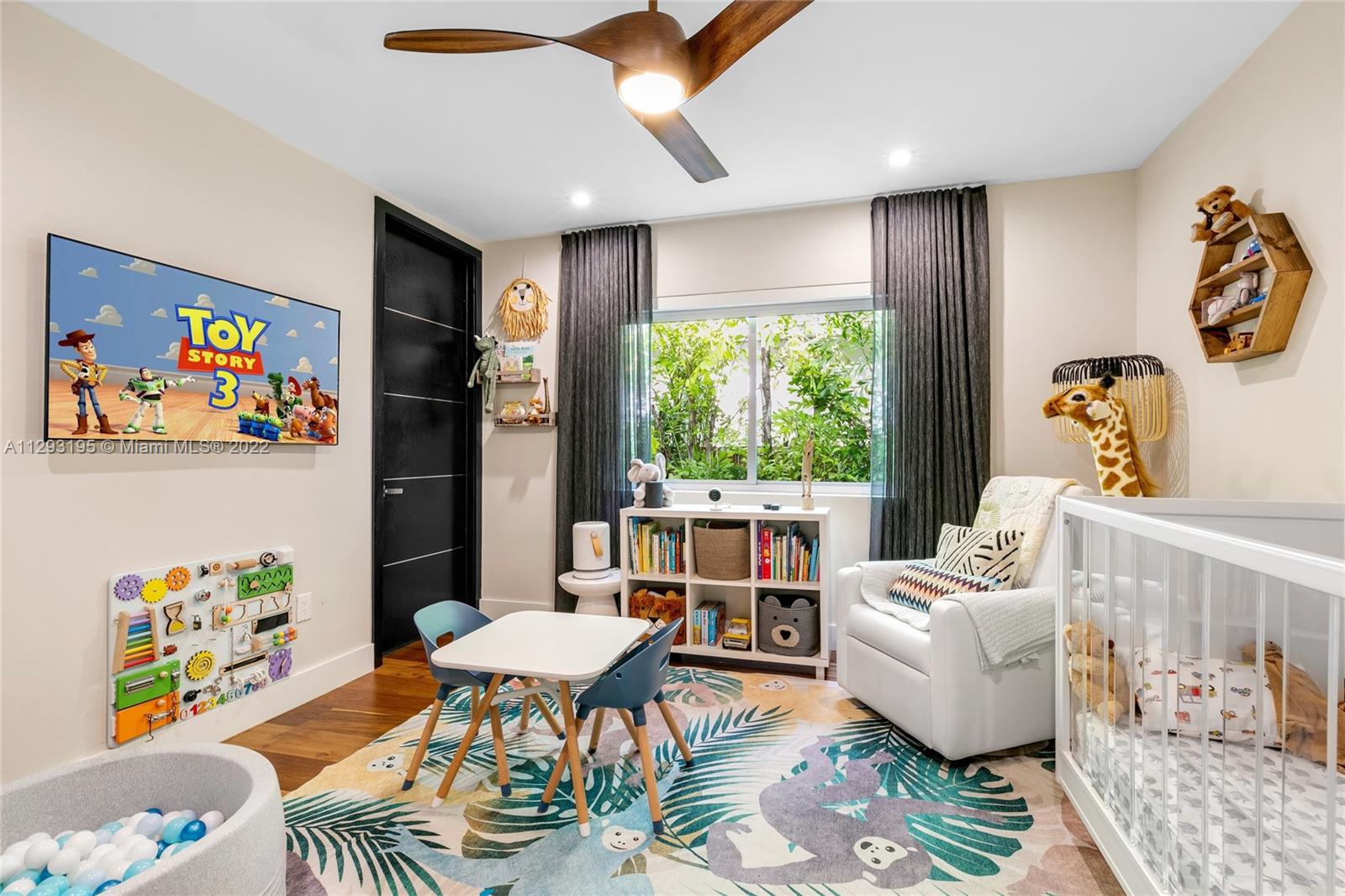 1666 Tigertail Avenue Miami, FL 33133 - Photo 23 of 41 a living room with furniture and a large window