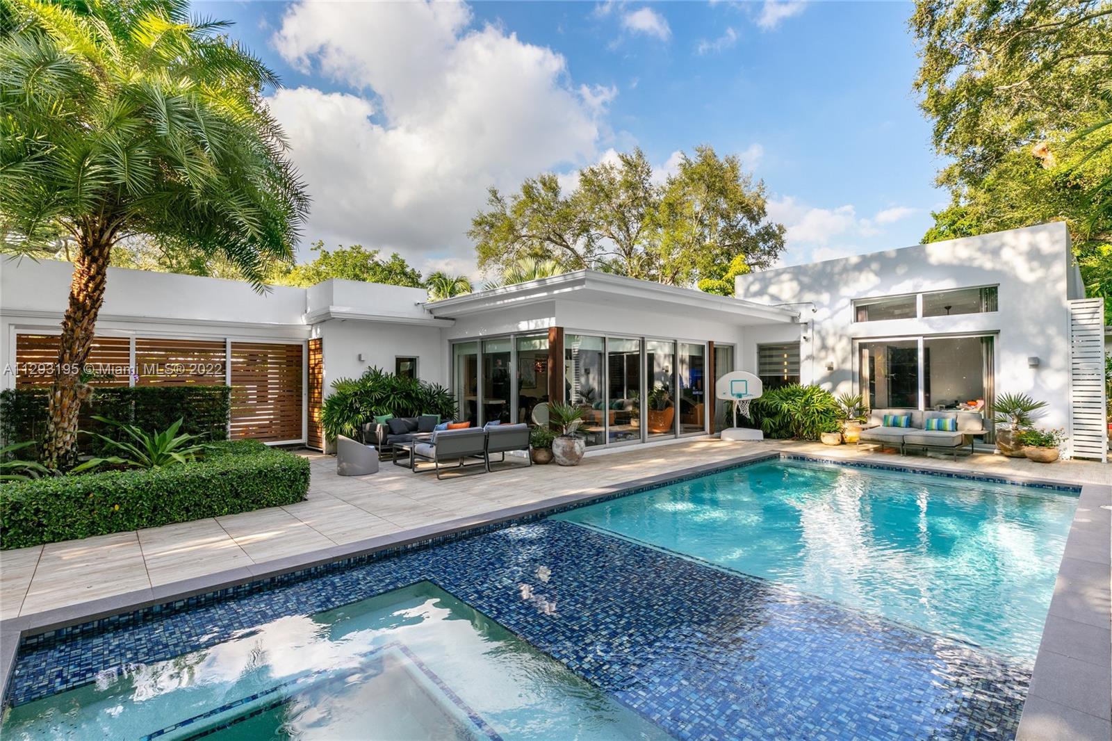 1666 Tigertail Avenue Miami, FL 33133 - Photo 30 of 41 a view of a house with swimming pool and sitting area