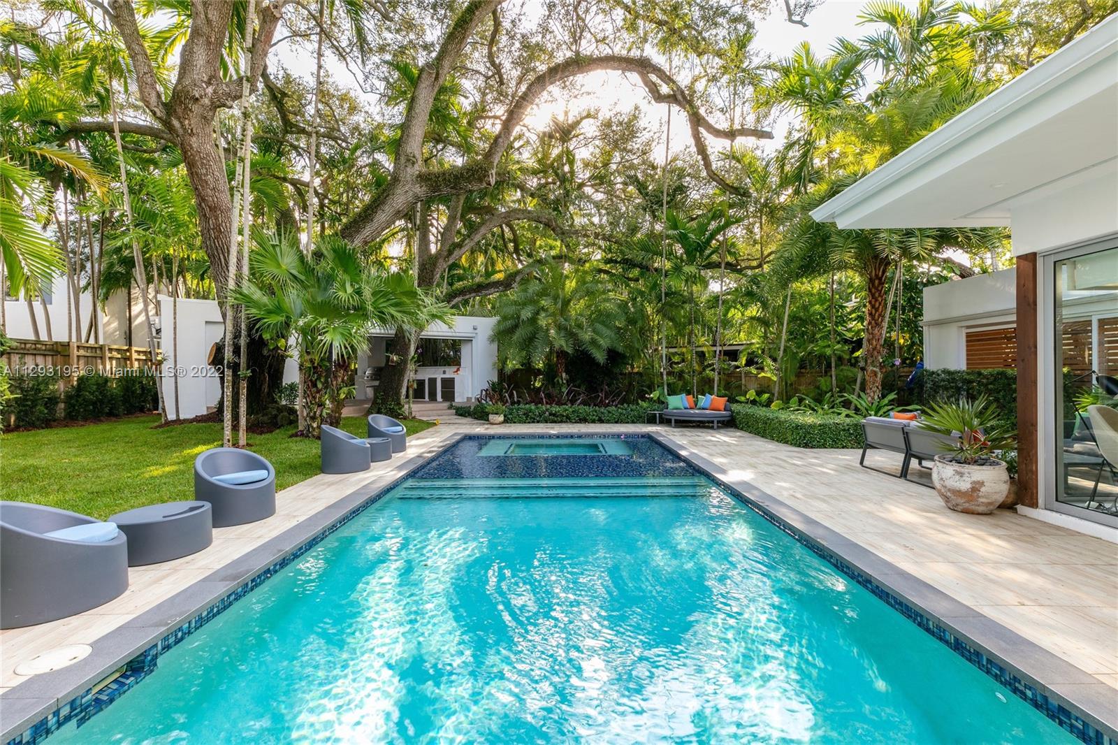 1666 Tigertail Avenue Miami, FL 33133 - Photo 32 of 41 a view of a swimming pool with a patio