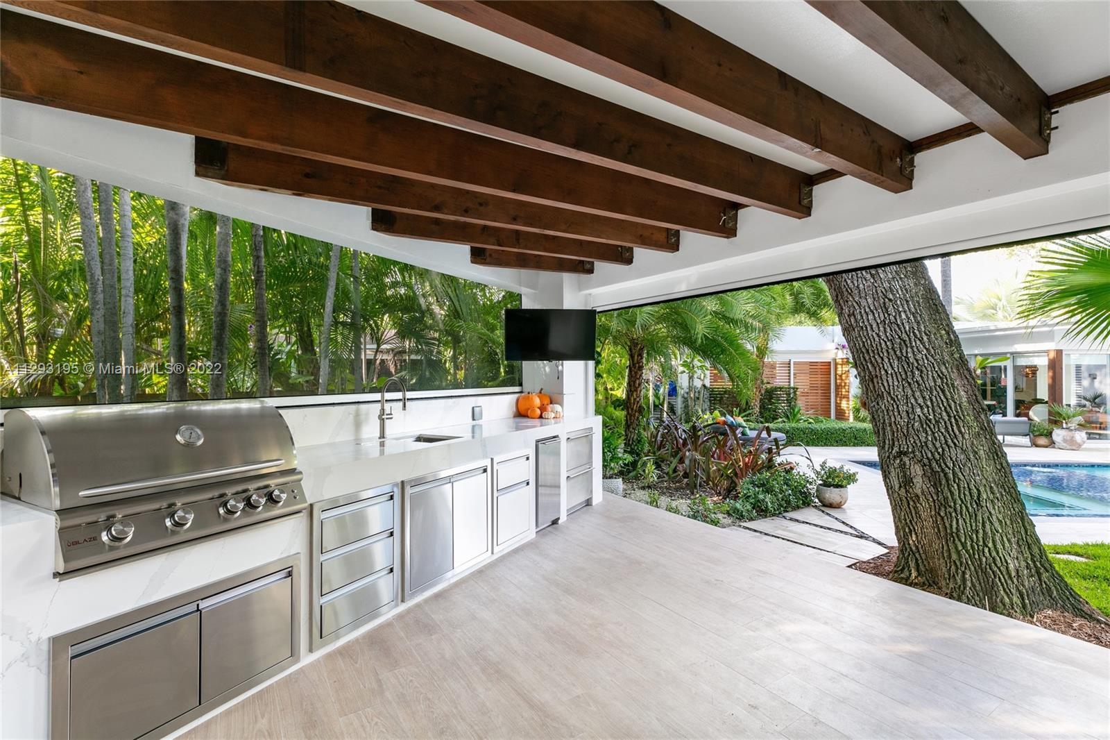 1666 Tigertail Avenue Miami, FL 33133 - Photo 34 of 41 a view of a porch with furniture and a porch