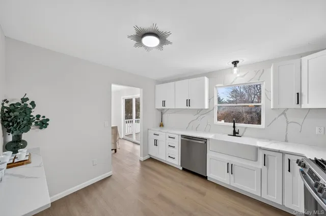 a bathroom with a toilet a sink and a mirror