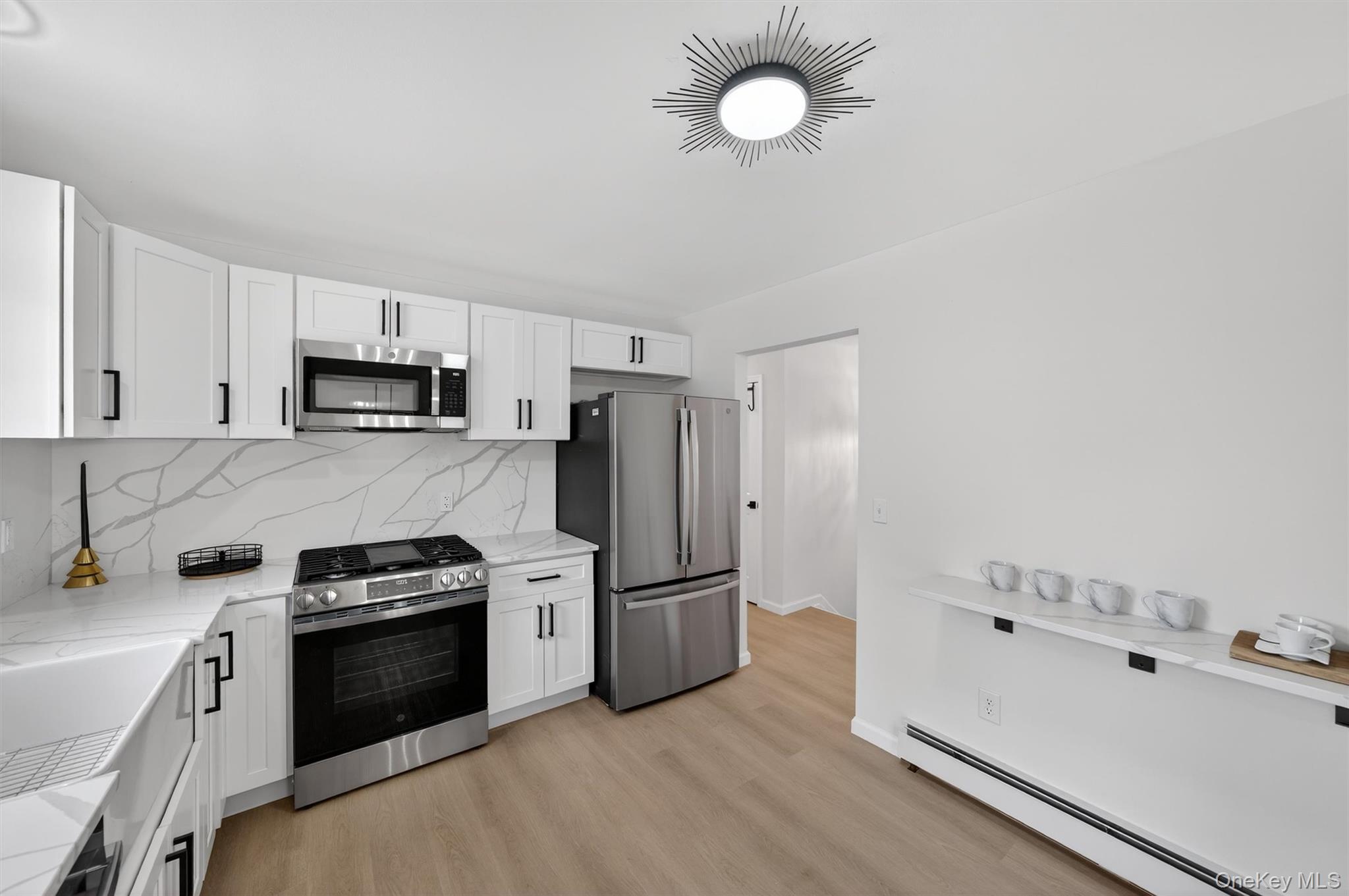 7 Edenville Road Warwick, NY 10990 - Photo 12 of 43 a kitchen with granite countertop a refrigerator stove and sink