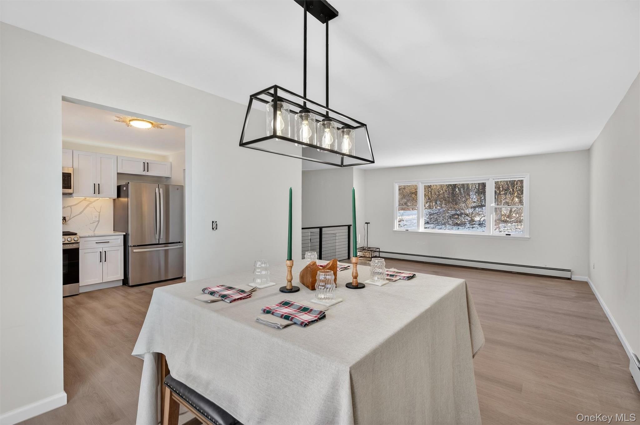 7 Edenville Road Warwick, NY 10990 - Photo 15 of 38 a view of a dining room with furniture and a chandelier