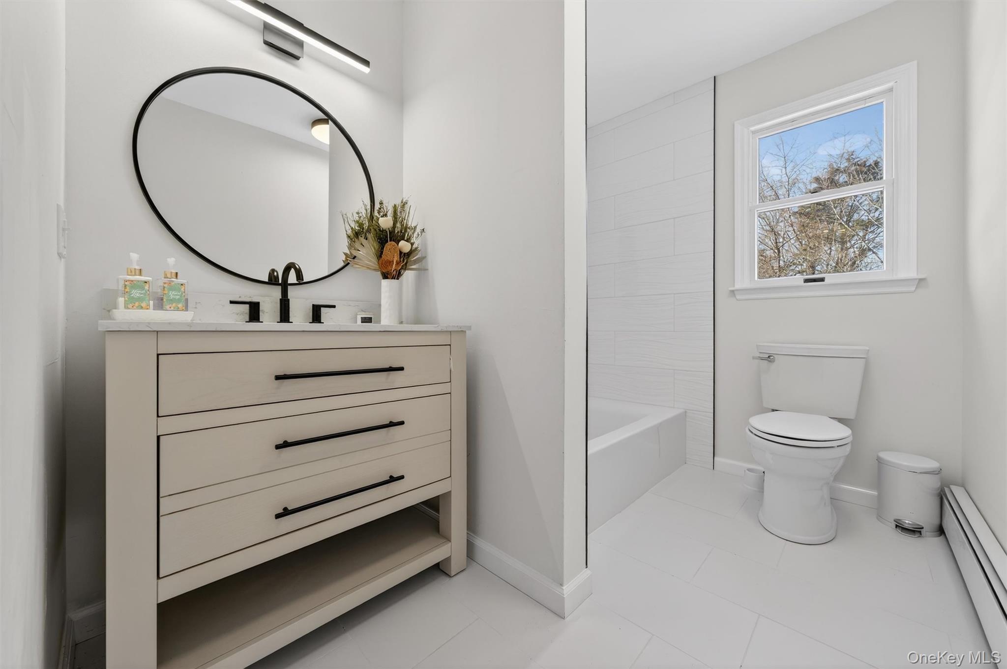7 Edenville Road Warwick, NY 10990 - Photo 17 of 38 a bathroom with a toilet a sink and a mirror