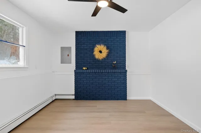 a bathroom with a sink mirror and toilet