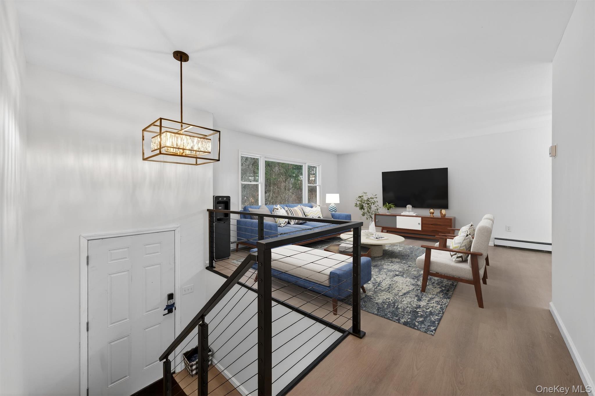 7 Edenville Road Warwick, NY 10990 - Photo 4 of 43 a view of a livingroom with furniture and a flat screen tv