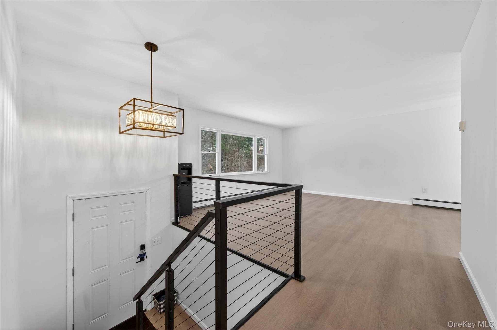 7 Edenville Road Warwick, NY 10990 - Photo 4 of 38 Corridor featuring an upstairs landing, wood finished floors, and a baseboard heating unit