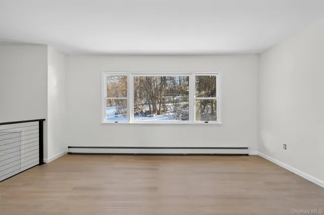 a dining room with a table and chairs