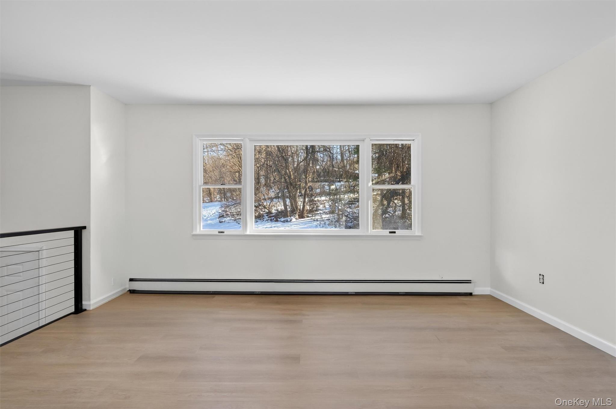 7 Edenville Road Warwick, NY 10990 - Photo 8 of 38 an empty room with wooden floor and windows