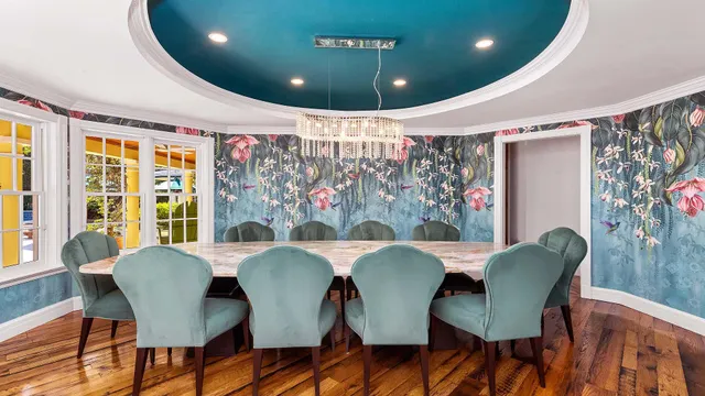 a dining room with furniture and window