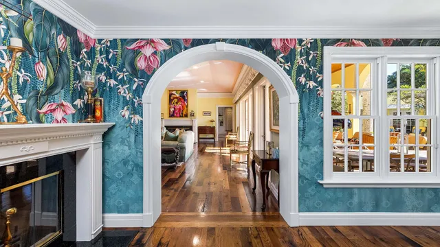 a view of living room with furniture and wooden floor