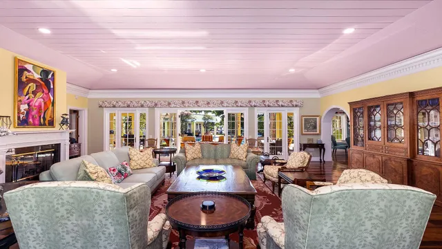 a living room with fireplace furniture and a flat screen tv