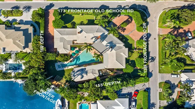 an aerial view of residential house with outdoor space and parking