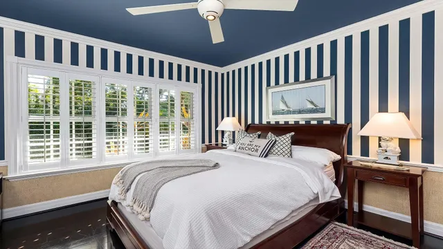 a bedroom with bed and a window