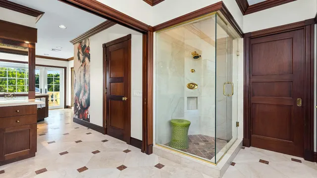 a bathroom with a tub sink and mirror