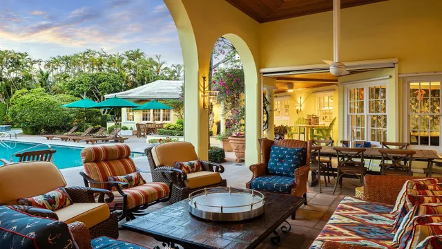 swimming pool view with a seating space and a garden view